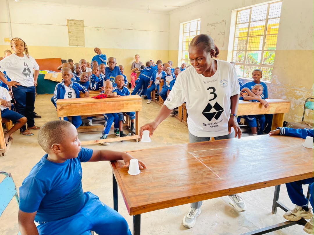 Teacher Grace leading an activity with all the children